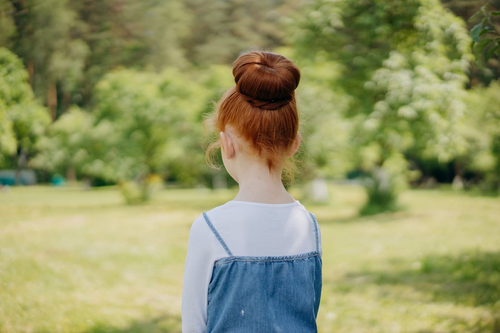 a girl with a bun hairstyle