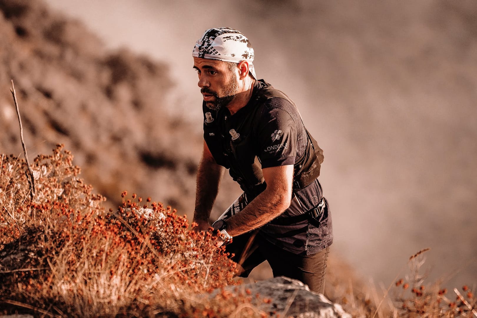 man climbing mountain