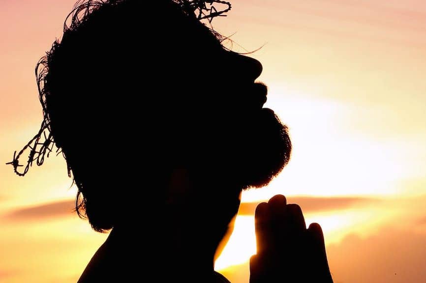 silhouette image of person praying